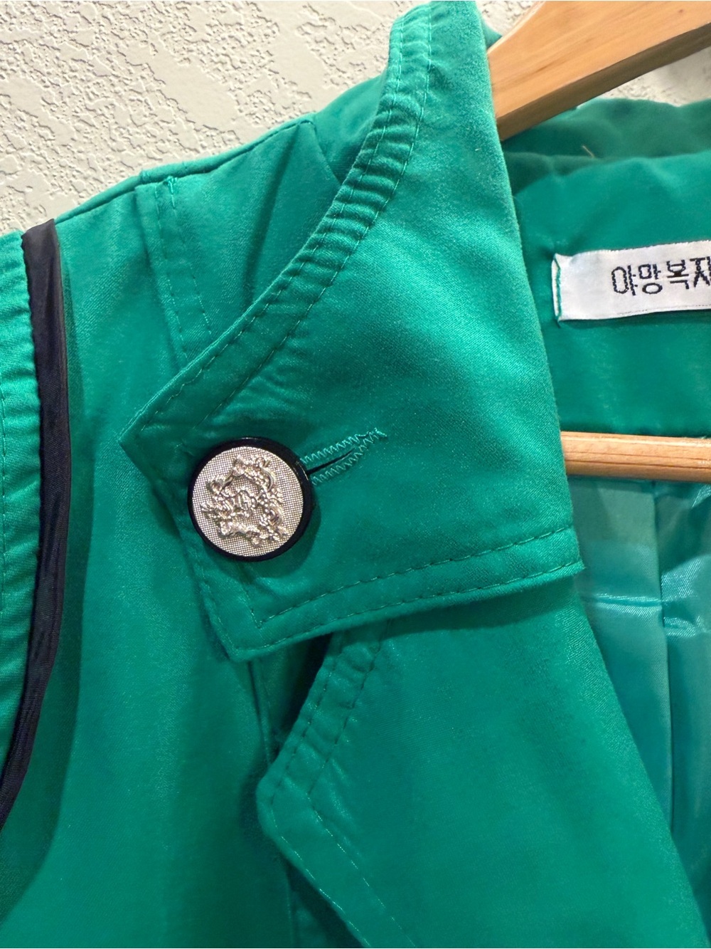 Size 2. Green Double-Breasted Trench Coat. Navy accented pockets. Silver buttons - Picture 2 of 13